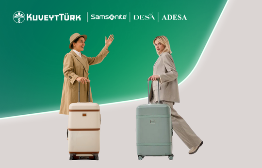 elinde valizleri ile yürüyen iki kadın
