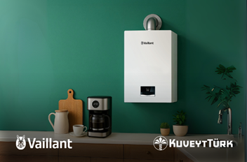 mutfakta vaillant kombi önünde kahve makinesi bardak ve musluk