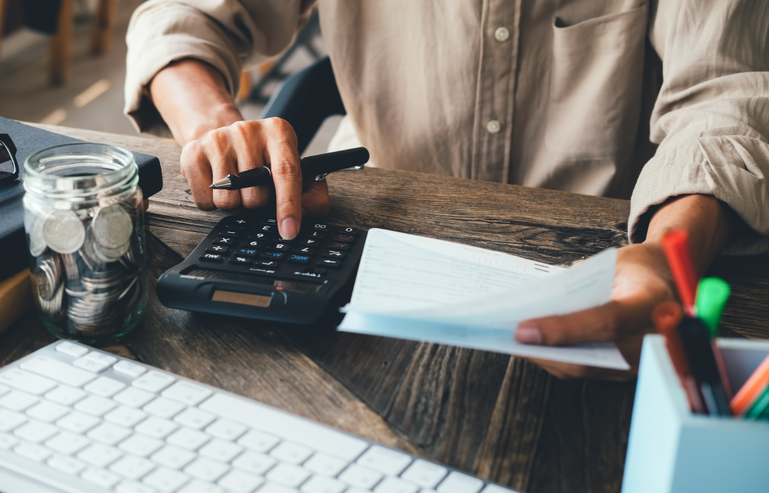  customer calculating their payments with a calculator
