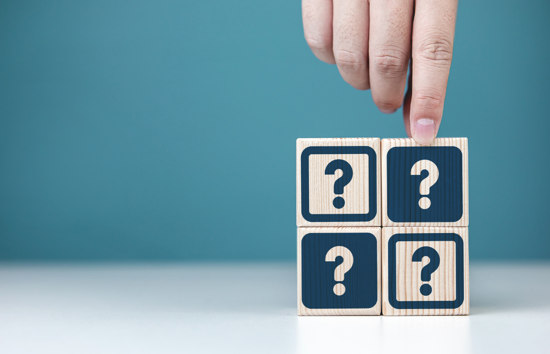 The hand that chooses one of the blocks with a question mark
