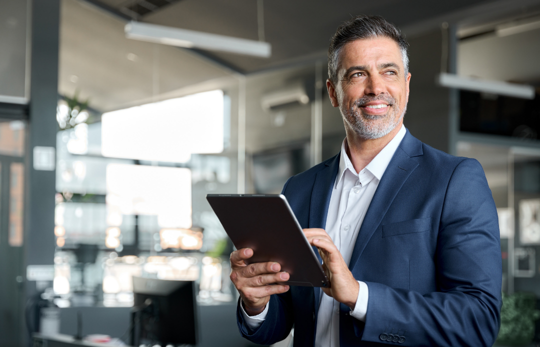 Manager working on tablet in office environment