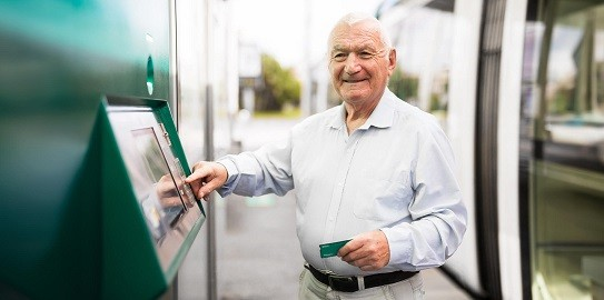retired uncle withdrawing his salary from ATM