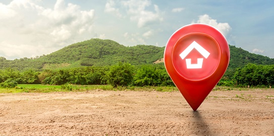 2B Financing concept with a location pin and house icon on the plot
