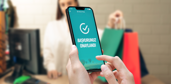 A phone showing approval for a consumer financing application during a shopping trip