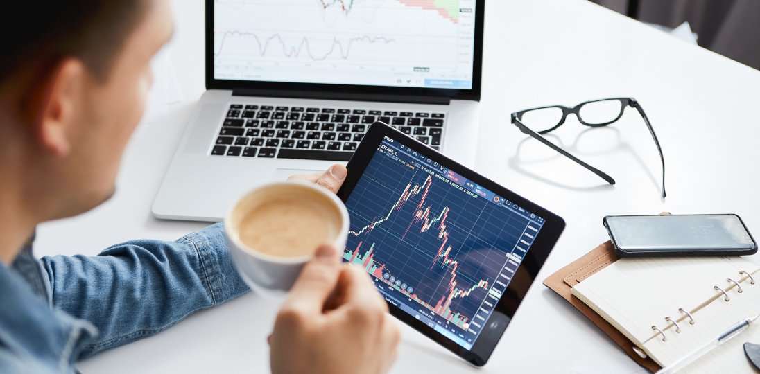 Person tracking stock transactions on a computer and tablet