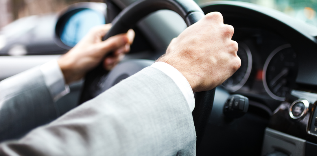 man driving a car