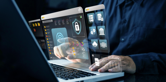 Person using laptop with digital security dashboard overlay