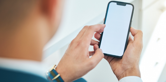 man in suit holding a phone