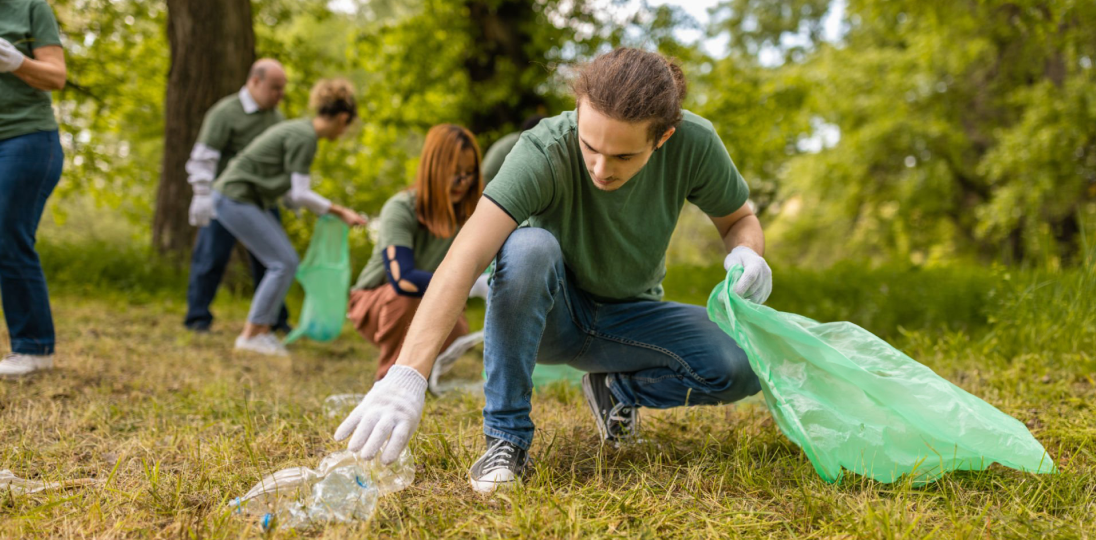 Young people collecting trash in nature