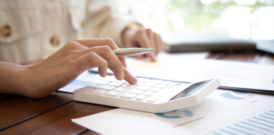 woman calculating payment on calculator