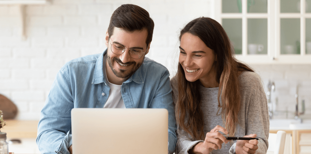 married couple looking at the computer
